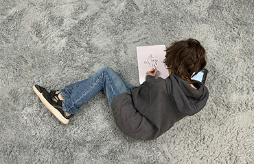 Student studying on floor
